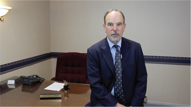 Steve Hogg Standing in an Office